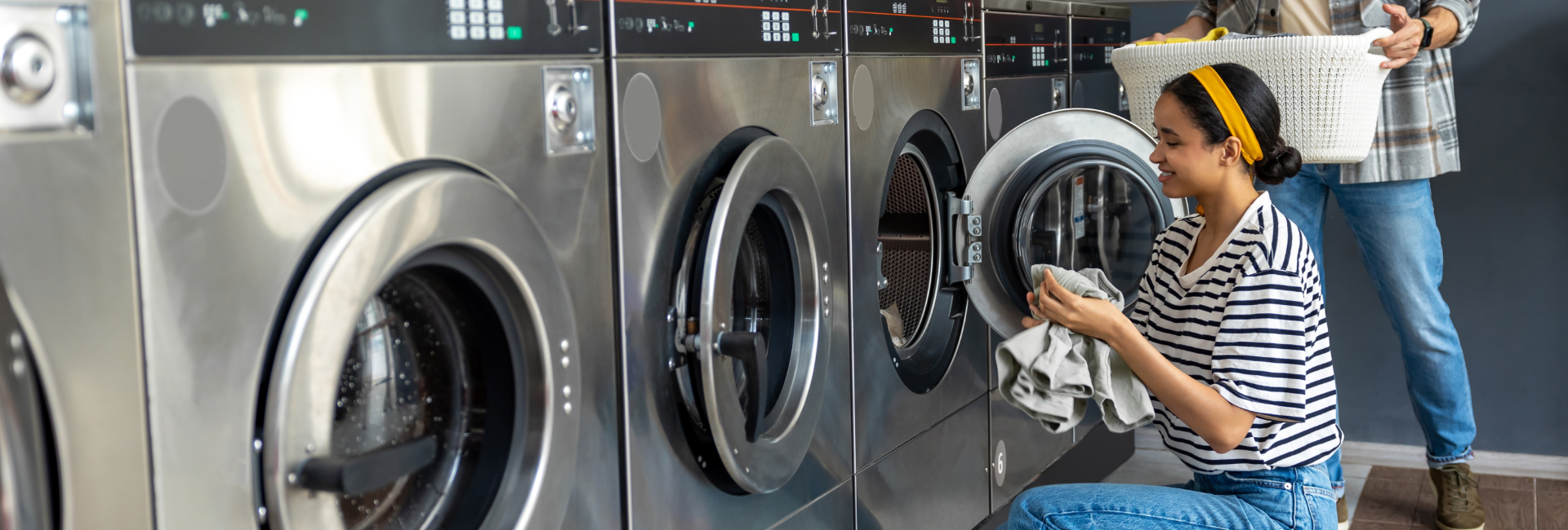 Girl With Yellow Headback Loading The Washer 1920X650